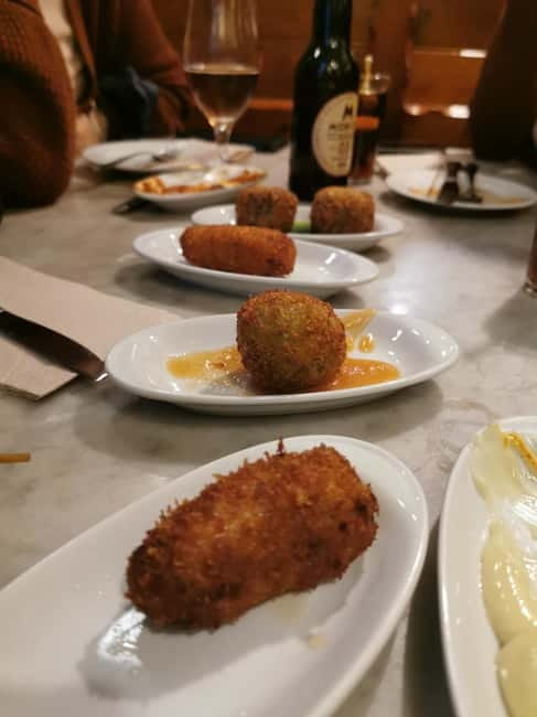 Barcelona: Tapas and Wine at the Hidden Bodegas Experience - Family taverns instead of polished tourist rooms