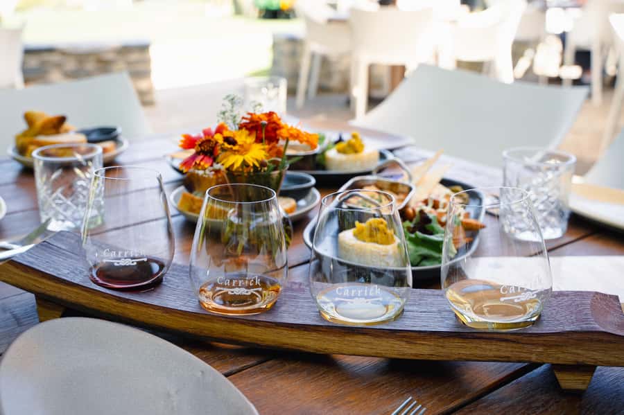 Boutique Winery Half-Day Tour & Vineyard Platter-Style Lunch - Carrick Winery lunch beside Lake Dunstan