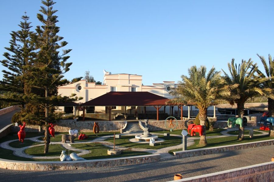 Lagoa: Guided Winery Tour and Local Wine Tasting - A winery visit with art in the foreground
