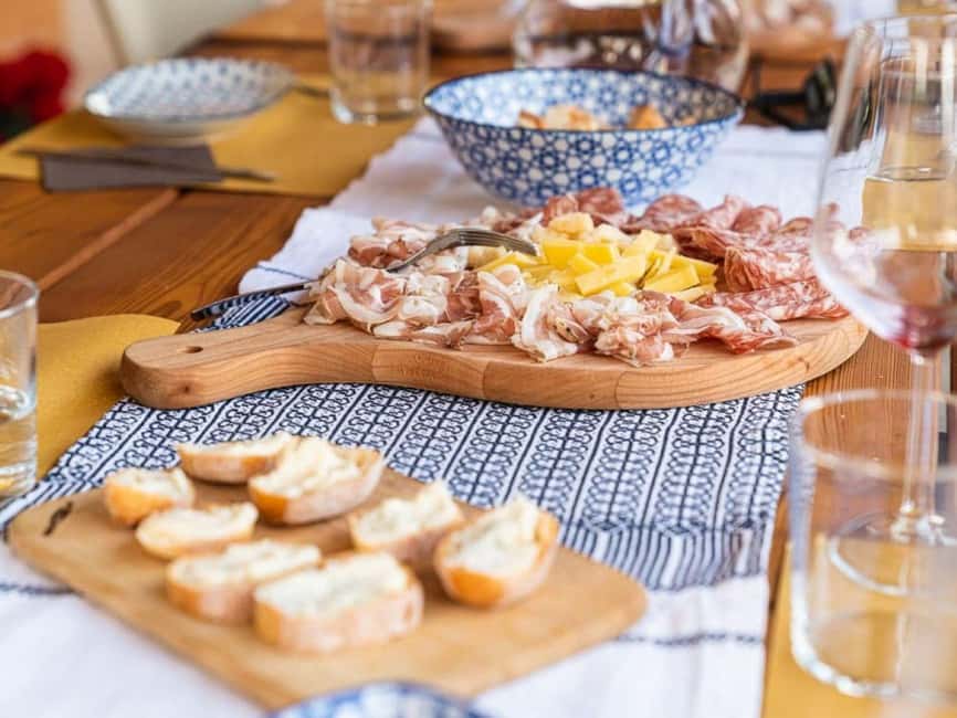 Mazzurega: Winery Tour with Tasting and Food Pairing - Walking through vines and olive trees