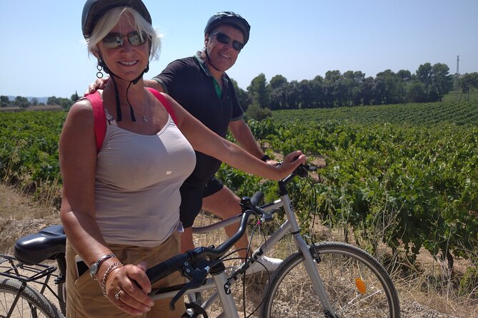 Paella Class, Winery & Bike Ride - Free Hotel Pickup from Sitges - Cycling beside Catalan vineyards