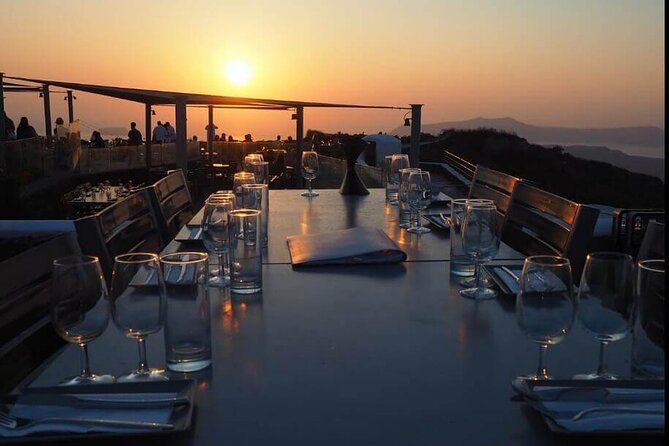 Santorini Sunset Wine Tour with Santo Winery Views - Pickup, minivan travel, and group size