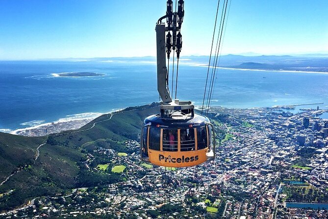 Table Mountain, Historic City and Winelands Private Day Tour - Taking the cable car up Table Mountain